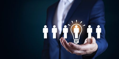Businessman touching bulb idea with people team in screen